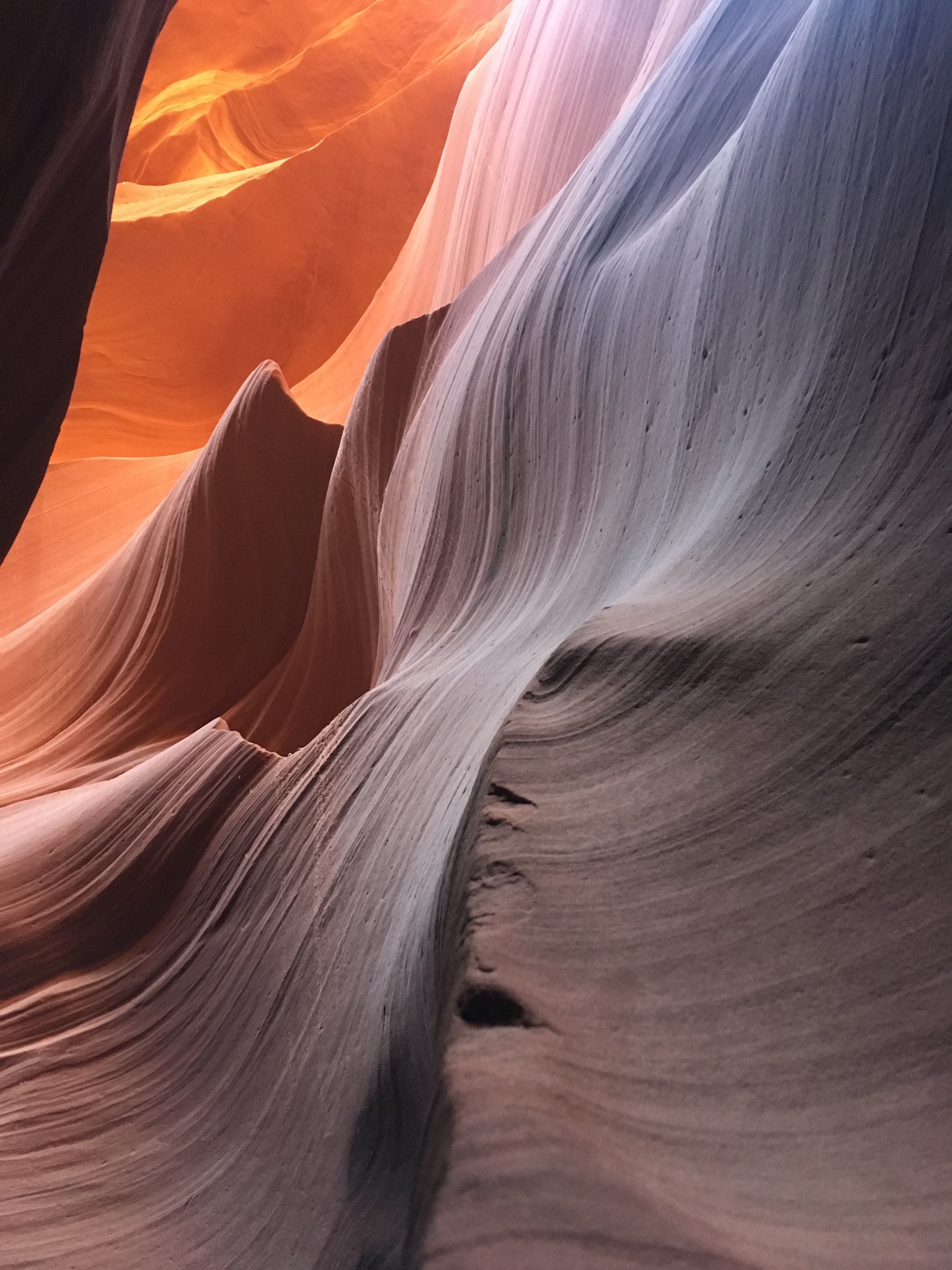 A canyon with wavy rocks